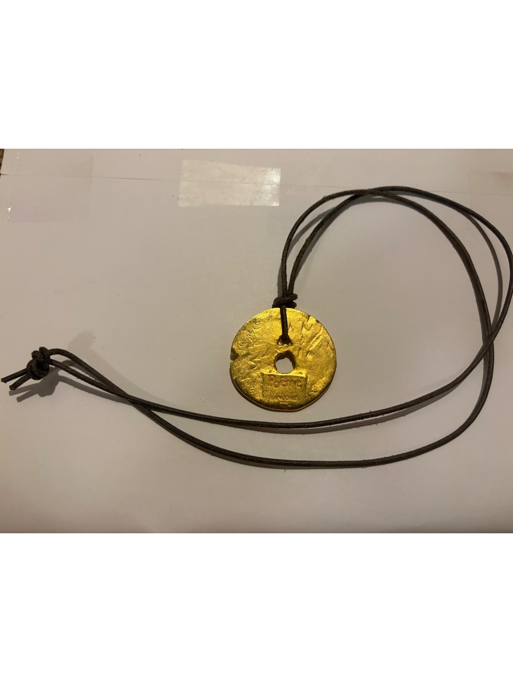 Gold tone engraved disc pendant necklace